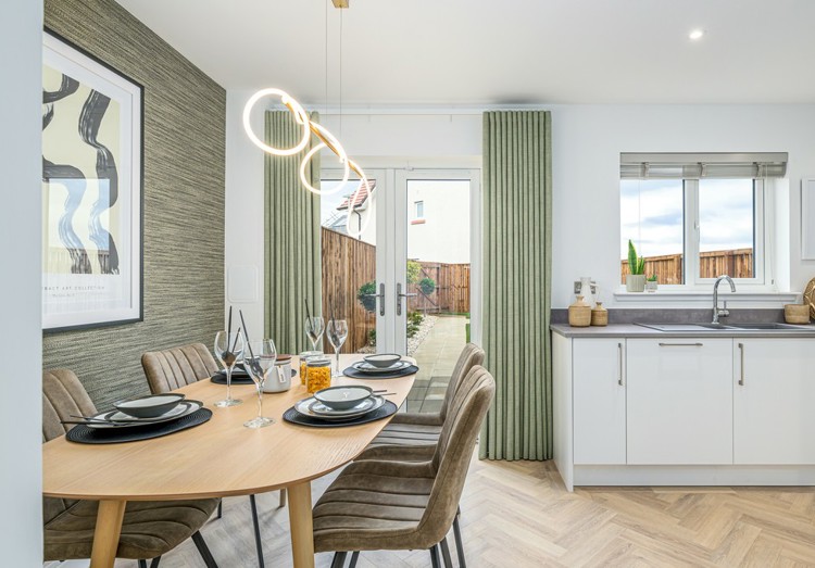 3 bedroom showhome | high spec kitchen and dining area with French doors to the garden
