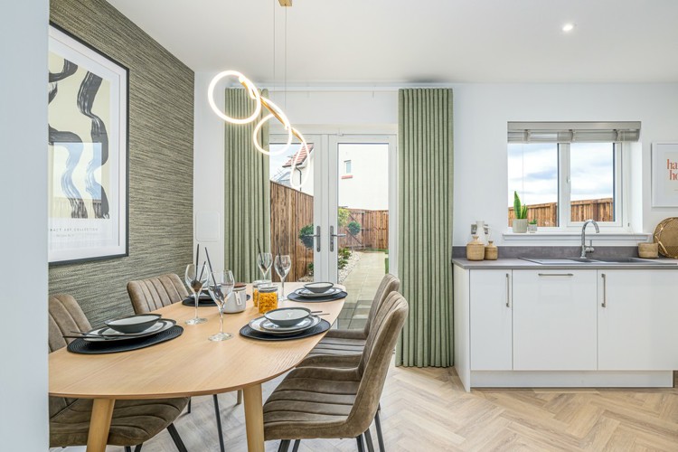 3 bedroom showhome | high spec kitchen and dining area with French doors to the garden