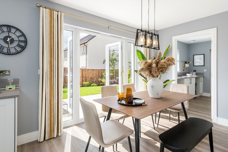 4 bedroom showhome | Open plan high spec kitchen and dining area with bi-fold doors to the garden