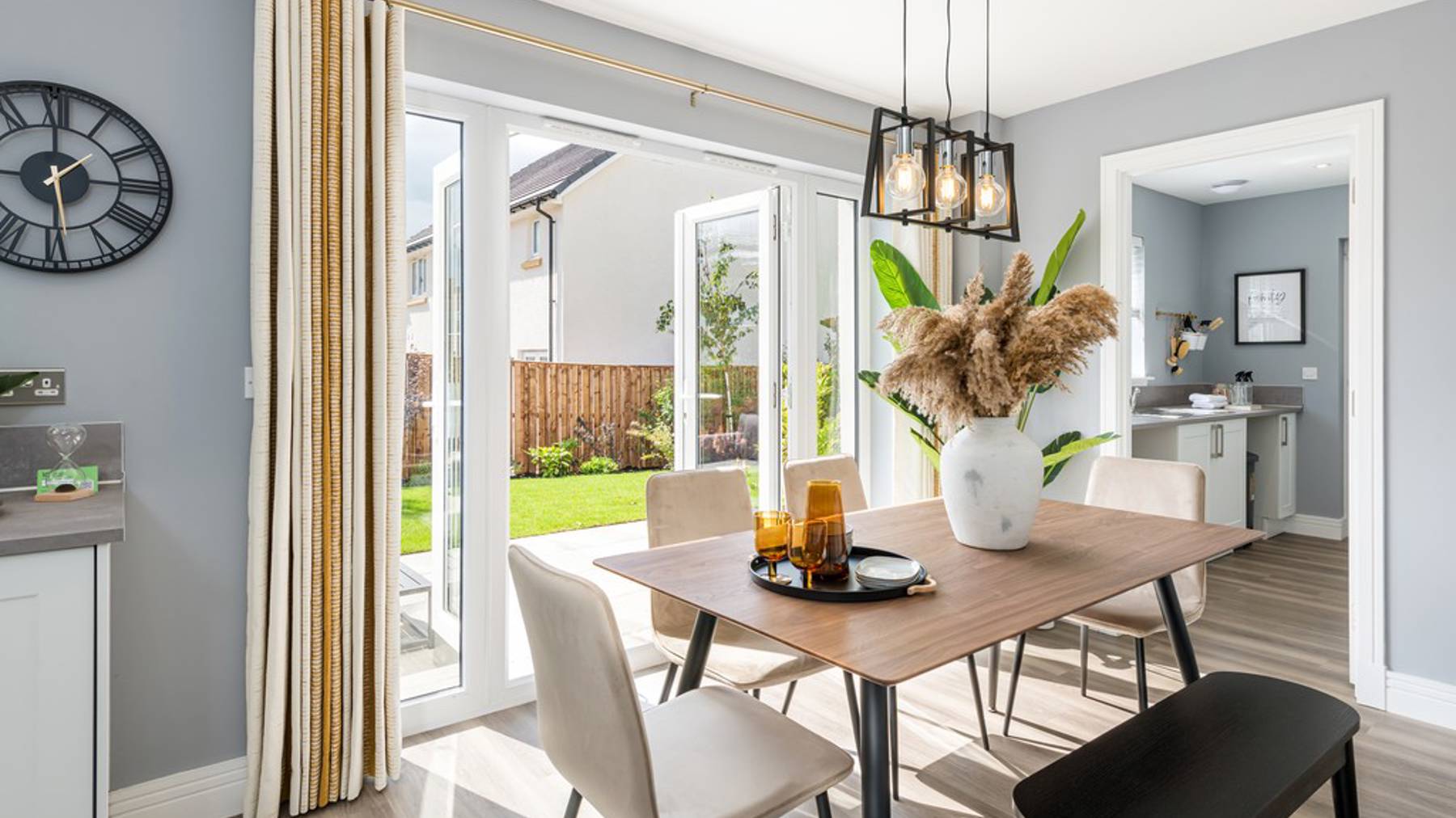 4 bedroom showhome | Open plan high spec kitchen and dining area with bi-fold doors to the garden