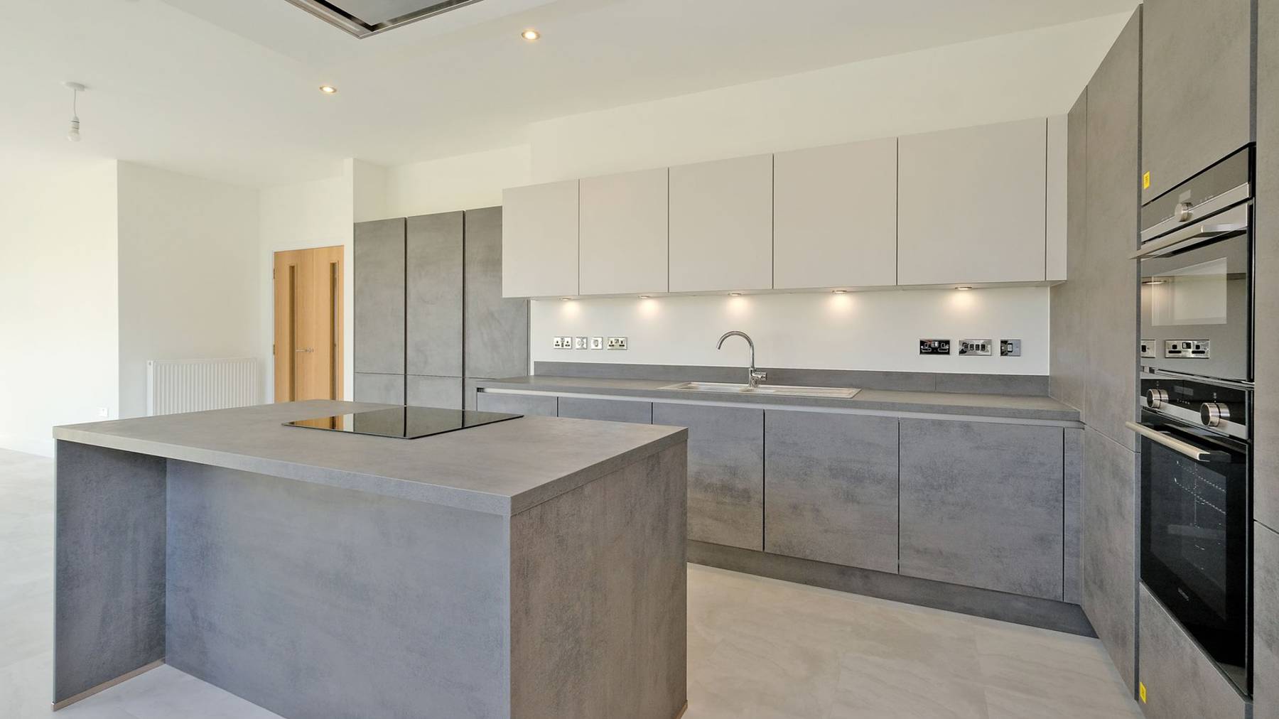 Image of the large and spacious grey kitchen 