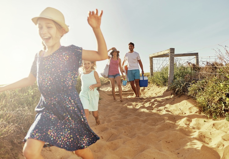 Family Running To Beach