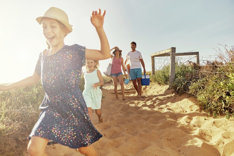 Family Running To Beach