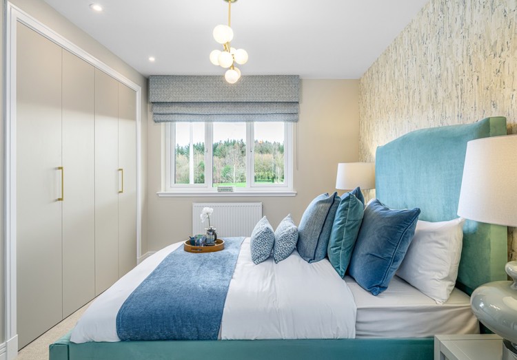 4 bedroom plus study showhome | bedroom with built-in storage and soft neutral tones