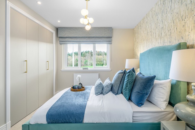 4 bedroom plus study showhome | bedroom with built-in storage and soft neutral tones