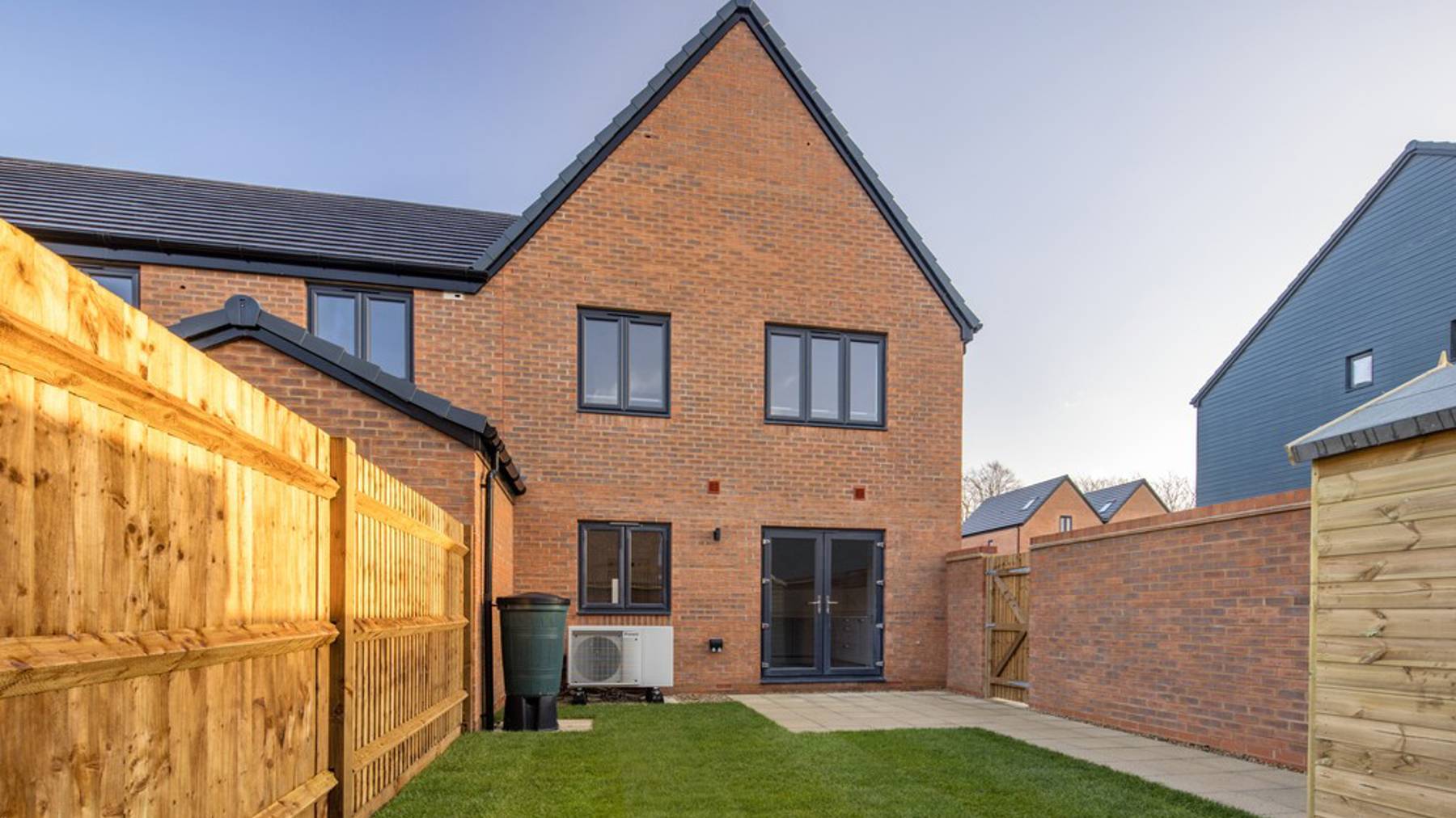 Turfed garden of houses for sale in Egham