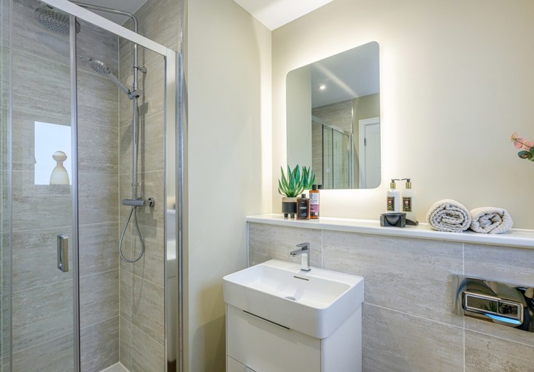 4 bedroom showhome | modern en suite with walk-in shower and chrome fixtures