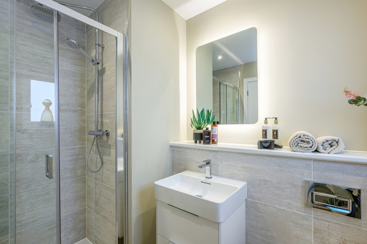 4 bedroom showhome | modern en suite with walk-in shower and chrome fixtures