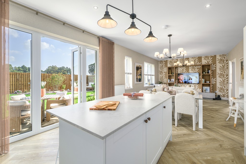 5 bedroom show home - View of the patio, kitchen island and open-plan dining and family area