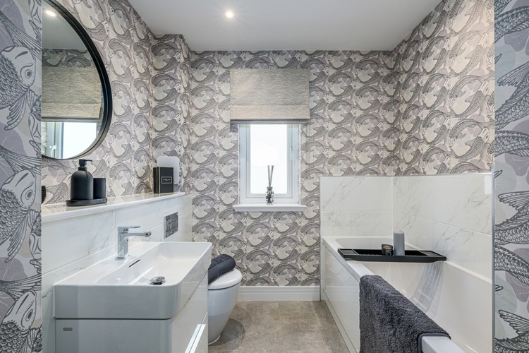 4 bedroom plus study showhome | stylish family bathroom with sleek fittings and half-height tiling