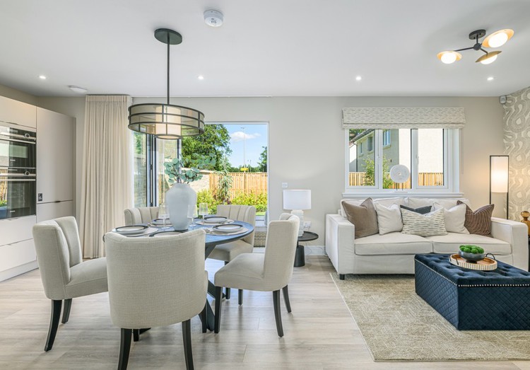 4 bedroom plus study showhome | open plan high spec kitchen and dining area with bi-fold doors to the garden