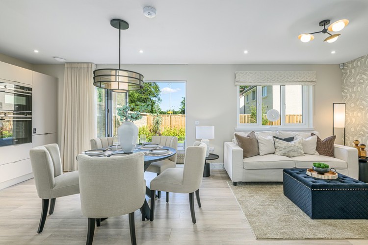 4 bedroom plus study showhome | open plan high spec kitchen and dining area with bi-fold doors to the garden