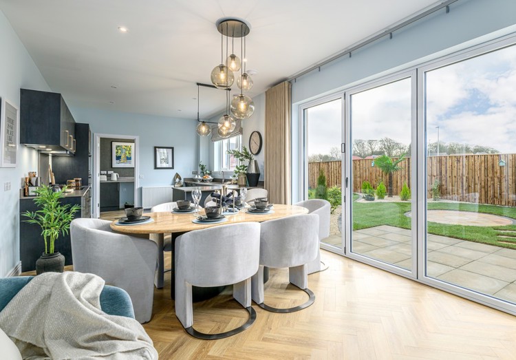 5 bedroom showhome | open plan studio-style kitchen, dining and family area with bi-fold doors to garden