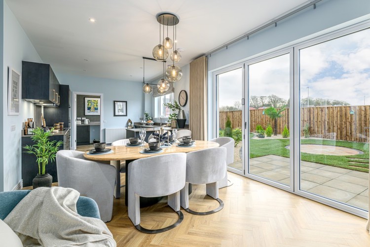 5 bedroom showhome | open plan studio-style kitchen, dining and family area with bi-fold doors to garden
