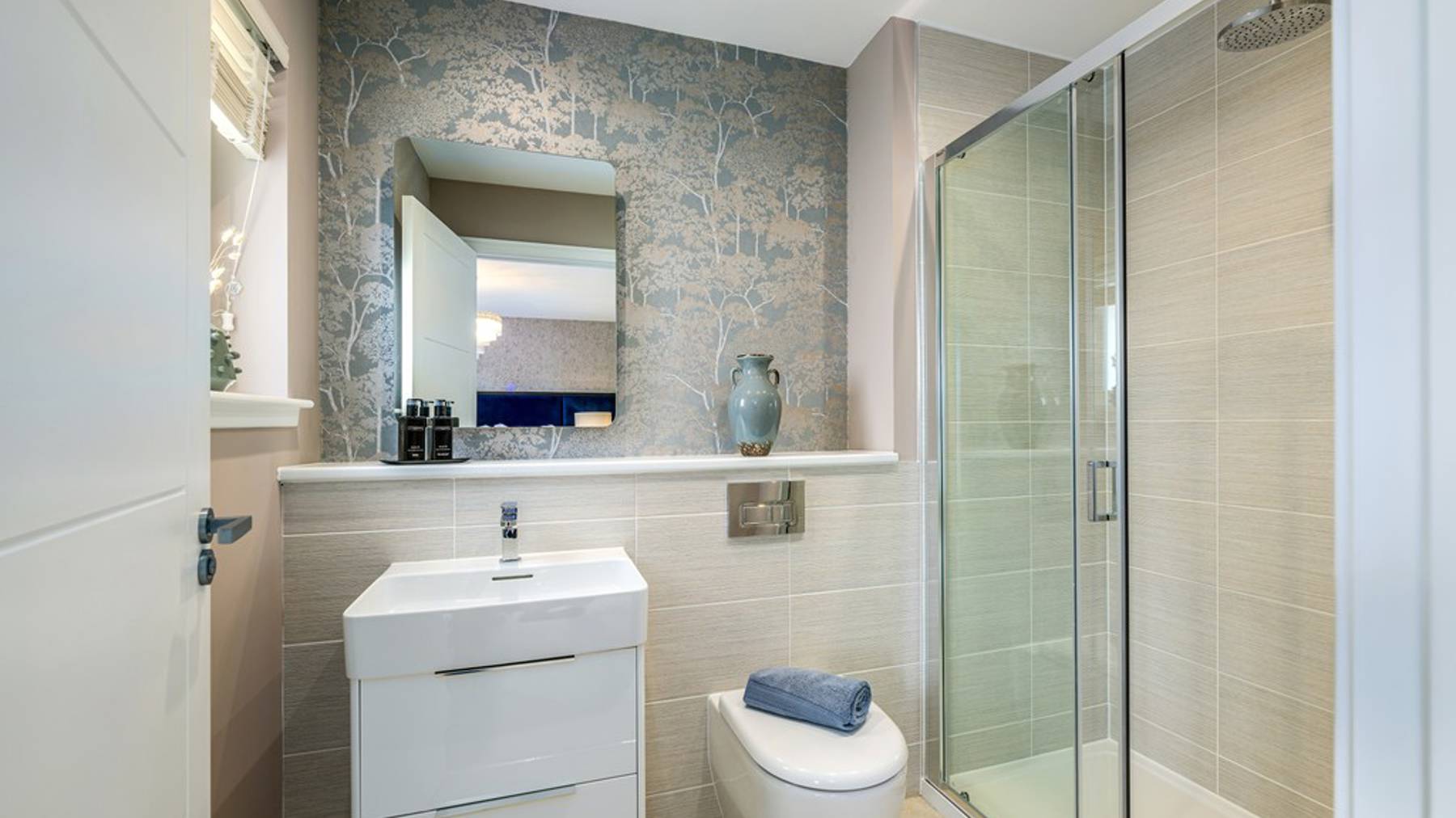 4 bedroom showhome | sleek en suites with chrome fittings and full-height tiling