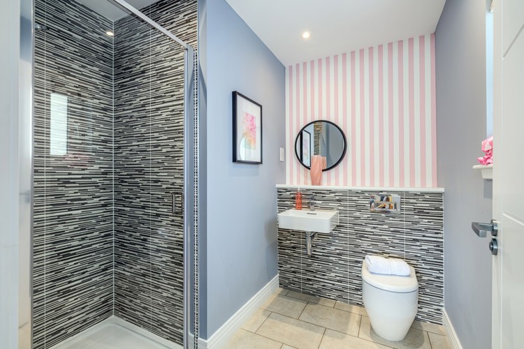 4 bedroom showhome | sleek en suites with chrome fittings and full-height tiling