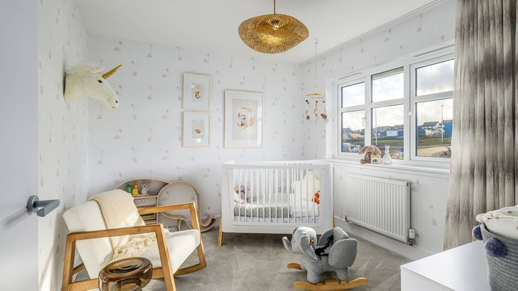 Bryce Bedroom 3 baby room with cot and rocking chair 