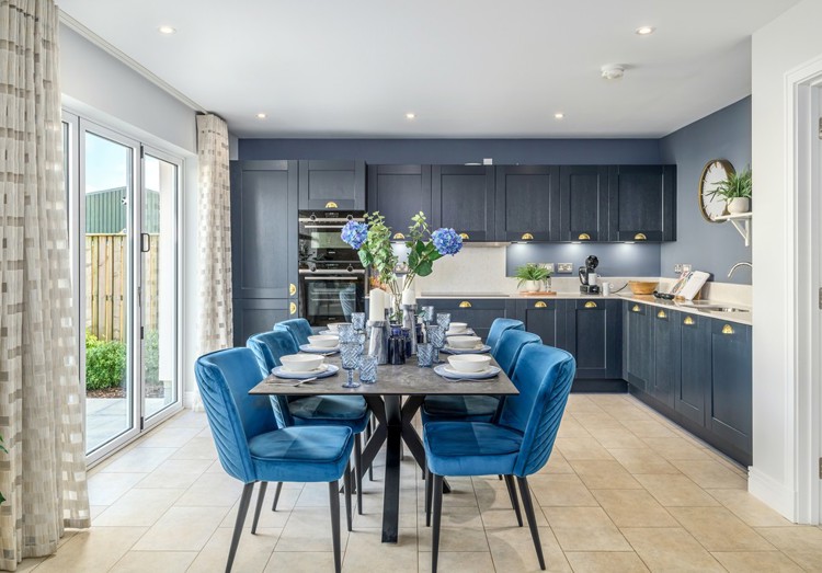 5 bedroom showhome | expansive open plan kitchen, dining and family area with bi-fold doors to rear garden