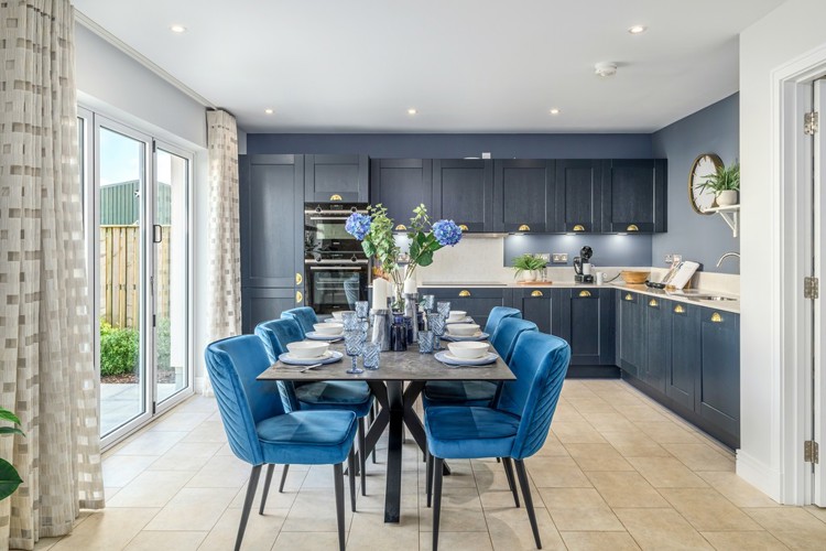 5 bedroom showhome | expansive open plan kitchen, dining and family area with bi-fold doors to rear garden