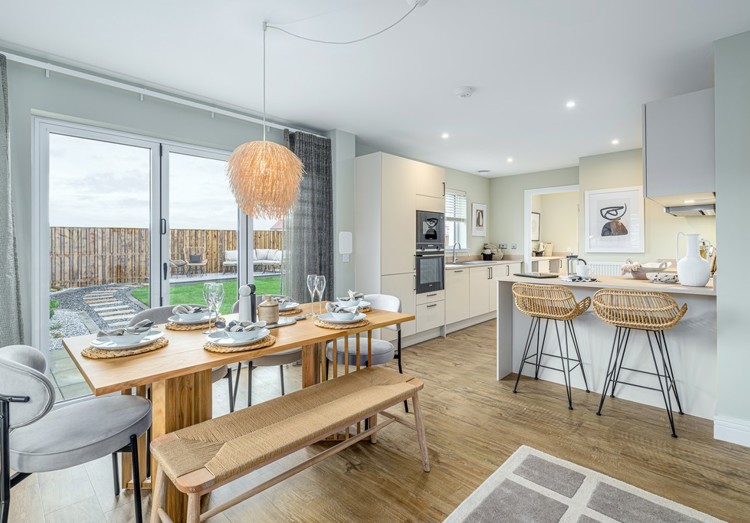 4 bedroom showhome | open plan studio-style kitchen, dining and family area with bi-fold doors to rear garden