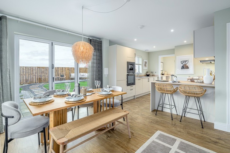 4 bedroom showhome | open plan studio-style kitchen, dining and family area with bi-fold doors to rear garden