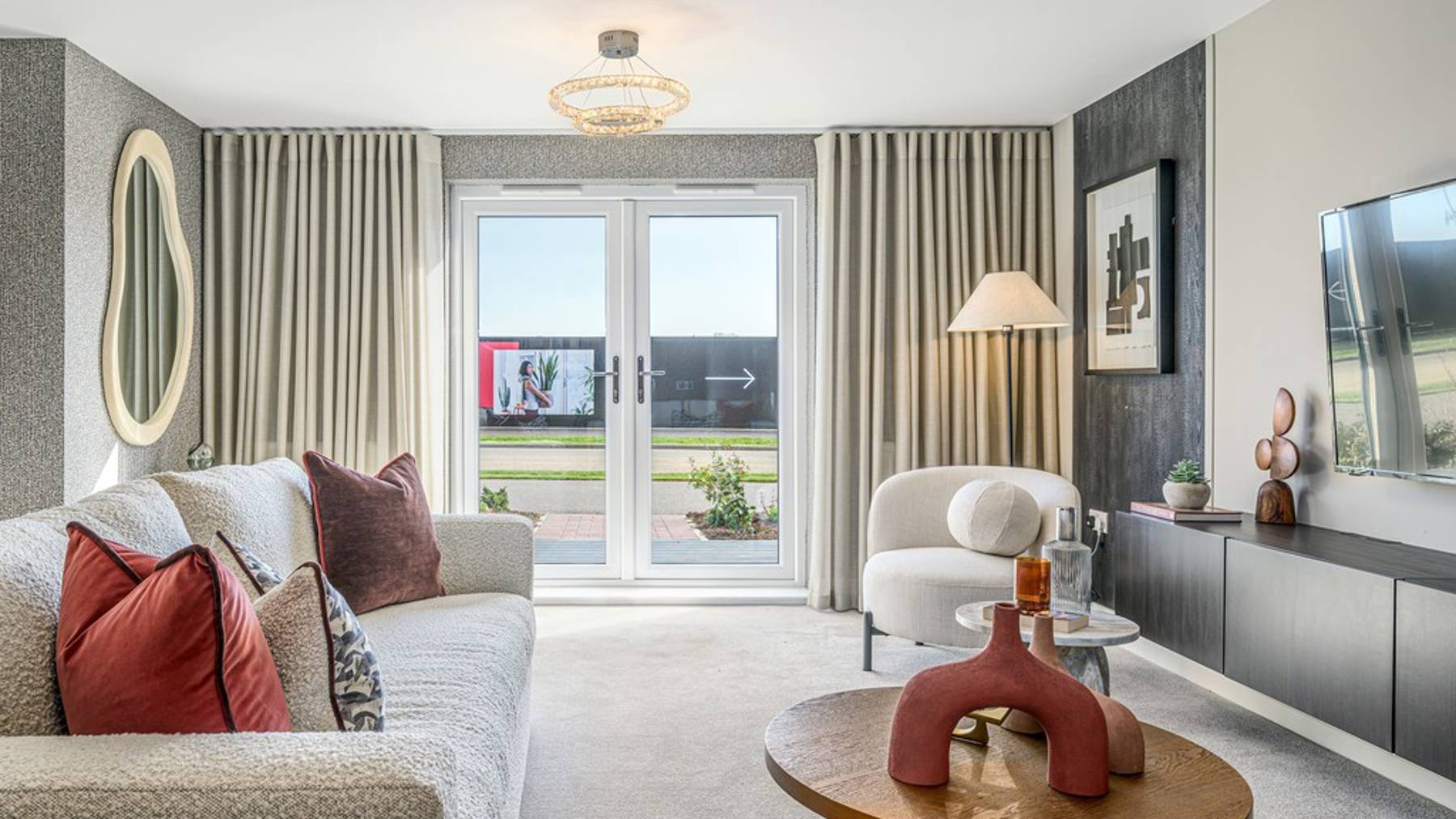 2 bedroom show apartment | open plan living area with French doors to patio 