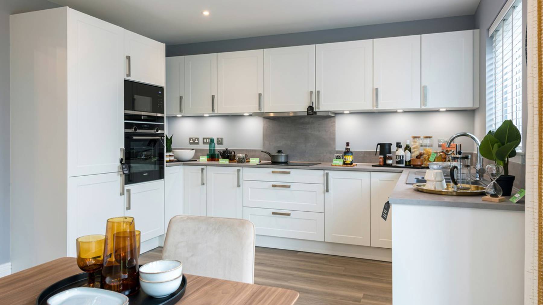 4 bedroom showhome | Open plan high spec kitchen and dining area with bi-fold doors to the garden