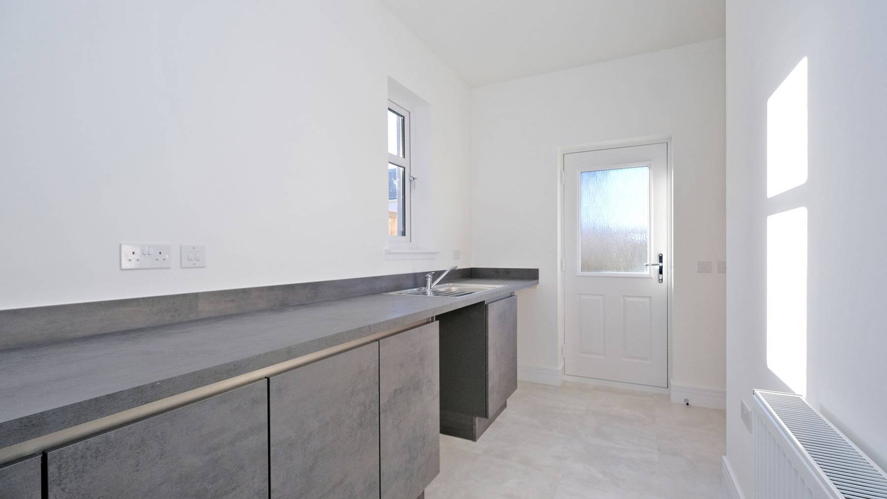 Large and spacious grey countertops utility 