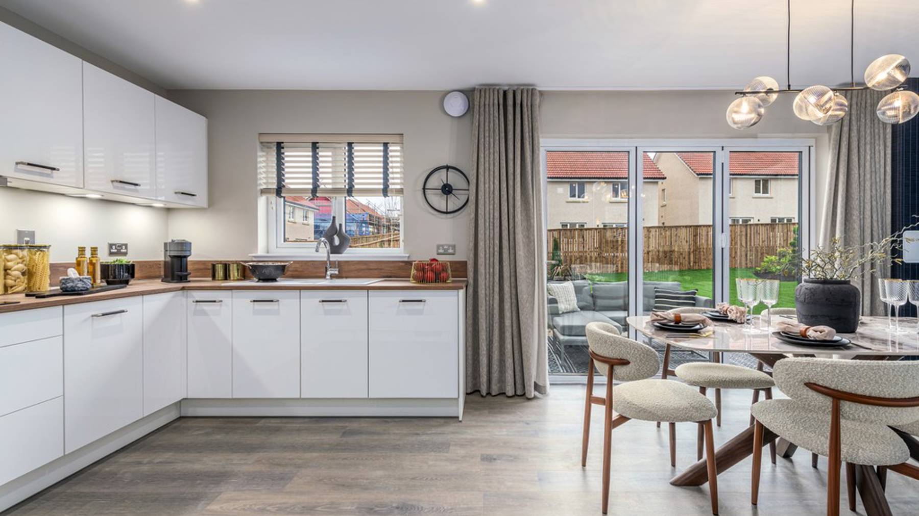 4 bedroom showhome | open plan kitchen and dining area with bi-fold doors to rear garden